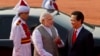 Indian Prime Minister Narendra Modi, center, talks to Vietnam's Prime Minister Nguyen Tan Dung, right, during a ceremonial reception at the forecourt of the Indian President's palace in New Delhi, Oct. 28, 2014.