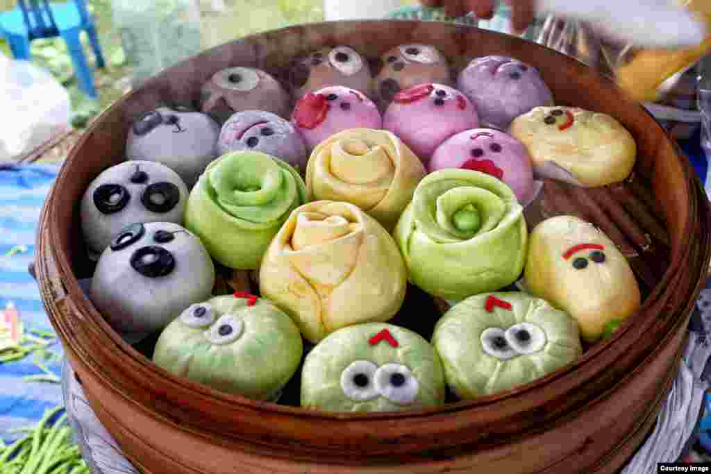Steamed Chinese-style buns, known locally as salapao, are decorated with faces during the start of the annual 10-day vegetarian festival in Bang Saphan, southern Thailand. (Photo taken by Matthew Richards)