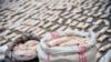 FILE - In this photo released by the Syrian official news agency SANA, Syrian authorities display captagon pills, in rural Damascus, Syria, Nov. 30, 2021. 