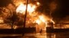 Firefighters extinguish a fire after a Russian attack on a residential neighborhood in Kharkiv, Ukraine, Feb. 10, 2024. 
