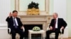 FILE - Chinese President Xi Jinping, left, gestures while speaking to Russian President Vladimir Putin during their meeting at the Kremlin in Moscow, Russia on March 20, 2023.