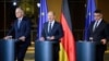 Federal Chancellor Olaf Scholz, center, speaks with Boris Rhein, right, Minister President of Hesse, and Stephan Weil, Minister President of Lower Saxony, after the federal-state summit in Berlin, Nov. 7, 2023.