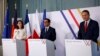 From left, German Foreign Minister Annalena Baerbock, French Foreign Minister Stephane Sejourne and Polish Foreign Minister Radoslaw Sikorski speak to reporters at the Chateau de La Celle Saint-Cloud near Paris, Feb. 12, 2024.