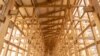 This April 2, 2024, photo shows construction of the 'Grand Roof,' one of the world's largest wooden structures, at the site of the 2025 Expo on Yumeshima island, an area of reclaimed land in Osaka, Japan. 