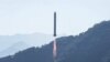 FILE - A Long March-2C rocket, carrying the Einstein Probe satellite, lifts off from the Xichang Satellite Launch Center in Xichang in China's Sichuan province, Jan. 9, 2024. The head of the U.S. space agency said China is using its civilian program to mask military objectives.