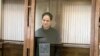 In this photo released by the Moscow's City Court, Wall Street Journal reporter Evan Gershkovich stands in a glass cage in a courtroom at the Moscow City Court in Moscow, Feb. 20, 2024. (Moscow City Court via AP)