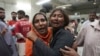 Women at a morgue in Karachi, Pakistan, mourn the loss of a family member who was killed in a stampede at a Ramadan food distribution center, March 31, 2023. 