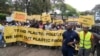 Climate activists carry banners and placards calling for a reduction in global plastic production ahead of the Intergovernmental Negotiating Committee on Plastic Pollution which will take place Nov. 13-19, in Nairobi, Nov. 11, ,2023. 