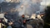 Palestinian emergency services look for survivors after an Israeli strike on a residential building in Rafah, Feb. 19, 2024.