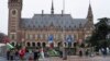 Pro-Palestinian, left, and pro-Israeli demonstrators, right, protest outside the United Nations' highest court during hearings in The Hague, Netherlands, Feb. 21, 2024, into the legality of Israel's occupation of the West Bank and east Jerusalem.