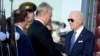 U.S. President Joe Biden is greeted by Lithuania's President Gitanas Nauseda as he arrives at Vilnius International Airport, in Vilnius, Lithuania, July 10, 2023.