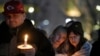 People attend a vigil for victims of a shooting at a Kansas City Chiefs Super Bowl victory rally in Kansas City, Missouri, Feb. 15, 2024. More than 20 people were injured and one woman killed in the shooting near the end of the rally at Union Station.