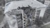This handout picture from the Ukrainian Emergency Service on Feb. 21, 2024 shows a damaged building, where four residents were wounded, after a night attack to Pokrovsk district, Donetsk region. (Photo by Handout/Ukrainian Emergency Service via AFP) 