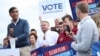 British Prime Minister Rishi Sunak, left, leader of the Conservative Party, speaks to supporters during his visit to Melksham in southwest England, June 7, 2024. 