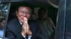 Kem Sokha, a founder of the Cambodia National Rescue Party, offers a greeting from his car in front of his house in Phnom Penh, Cambodia, March 3, 2023. 