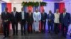 FILE - Haiti's transitional presidential council members pose for a group photo in Port-au-Prince, Haiti, April 30, 2024. Louis Gerald Gilles is pictured on the right. Smith Augustin is third from right and Emmanuel Vertilaire is fourth from right. 