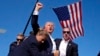 FILE - Republican presidential candidate former president Donald Trump is surrounded by U.S. Secret Service agents following an assassination attempt at a campaign rally, in Butler, Pennsylvania, July 13, 2024, in this image by AP journalist Evan Vucci.