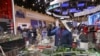A visitor takes pictures of an exhibition stand at the St. Petersburg International Economic Forum (SPIEF) in Saint Petersburg, Russia, June 5, 2024. 