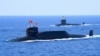 FILE - A nuclear-powered Type 094A Jin-class ballistic missile submarine of the Chinese People's Liberation Army (PLA) Navy is seen during a military display in the South China Sea, April 12, 2018. 