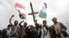 FILE - Houthi supporters attend a rally against the US airstrikes on Yemen and the Israeli offensive against the Palestinians in the Gaza Strip, in Sanaa, Yemen, March 8, 2024.