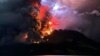 This handout photograph taken and released by the Center for Volcanology and Geological Hazard Mitigation on April 17, 2024, shows Mount Ruang spewing hot lava and smoke as seen from Sitaro, North Sulawesi.