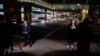Television reporters broadcast in front of the University of Cincinnati Medical Center, in Cincinnati, Ohio, Jan. 2, 2023.