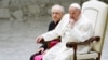 FILE - Pope Francis attends the weekly general audience in Paul VI hall at the Vatican, March 27, 2024. 