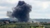 Smoke billows after an Israeli strike on the southern Lebanese border village of Tayr Harfa on April 6, 2024.