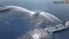 In this image made from video provided by the Philippine Coast Guard, a Philippine Coast Guard vessel is water cannoned by the Chinese Coast Guard as it tries to approach the waters near Scarborough Shoal in the South China Sea on April 30, 2024. 