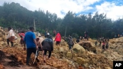 ภาพจากองค์กรผู้อพยพระหว่างประเทศ หรือ IOM แสดงให้เห็นความเสียหายจากดินถล่มที่หมู่บ้านยัมบาลี ปาปัวนิวกีนี เมื่อวันที่ 24 พ.ค. 2024 