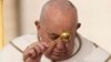 Pope Francis asperses holy water as he celebrates Easter Mass in St. Peter's Square at the Vatican, March 31, 2024. 