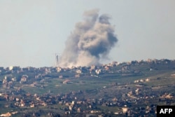 This picture taken from Israel along the border with southern Lebanon shows smoke billowing above the Lebanese village of Bint Jbeil during Israeli bombardment, Feb. 28, 2024.