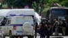 Russian policemen and members of "Rosgvardiya," a Russian national guard, gather not far from a pretrial detention center in Rostov-on-Don, June 16, 2024. 