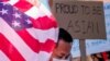 FILE - People take part in a Stop Asian Hate rally at Times Square in New York City, April 4, 2021.