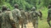 Wanajeshi wa Uganda wakionekana kwenye barabara ya Mbau-Kamango wilayani Beni, Disemba 8, 202, kuwasaka waasi wa ADF. Picha ya AFP