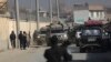 Afghan security forces' vehicles are seen at the site of a shootout in Kabul, Afghanistan, Monday, Dec. 2, 2019.