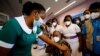 FILE - Director General of the Ghana Health Service Dr. Patrick Kuma-Aboagye receives the coronavirus disease (COVID-19) vaccine during the vaccination campaign at the Ridge Hospital in Accra, Ghana, March 2, 2021.