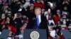 President Donald Trump waves after speaking at a campaign rally at the Waukesha County Airport on Oct. 24, 2020, in Waukesha, Wisconsin. 