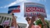 FILE - Immigration activists rally outside the Supreme Court as the justices hear arguments over the Trump administration's plan to ask about citizenship on the 2020 census, in Washington, April 23, 2019.