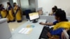 An all-female bank staff are pictured at their terminals during the inauguration of the first branch of the Bharatiya Mahila Bank (BMB), India's first state owned women's bank, in Mumbai, Nov. 19, 2013.