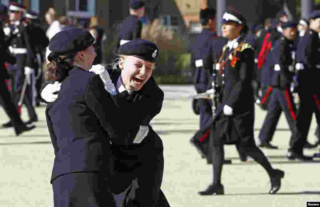 Students react after a surprise visit by Britain's Prince Harry to The Duke of York's Royal Military School in Dover, southern England, Sept. 28, 2015.