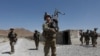 FILE - U.S. troops patrol at an Afghan National Army base in Logar province, Afghanistan, Aug. 7, 2018.