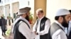 In this photo released by the Foreign Office, Pakistan's Foreign Minister Shah Mehmood Qureshi, center, receives members of Taliban delegation at the Foreign Office in Islamabad, Pakistan, Thursday, Oct. 3, 2019. Senior Taliban leaders are meeting…