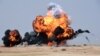 Smoke and fire billows following an aerial bombardment during the Northern Thunder military exercises in Hafr al-Batin, 500 kilometres north-east of the Saudi Capital Riyadh on March 10, 2016.