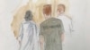 In this courtroom sketch, Ruslan Maratovich Asainov, left, is escorted into federal court, Feb. 7, 2023, in New York.