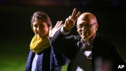 Nazanin Zaghari-Ratcliffe, left, and Anoosheh Ashoori, who were freed from Iran, wave after landing at RAF Brize Norton in Brize Norton, England, March 17, 2022. 