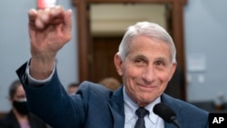 FILE - Dr. Anthony Fauci, Director of the National Institute of Allergy and Infectious Diseases, waves to a House committee at the start of a hearing on Capitol Hill in Washington on May 11, 2022. Fauci, who has advised seven U.S. presidents, says he plans to retire in 2025.