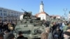 People surround a group of US Army Stryker armored vehicles from the 3rd Squadron of the 2nd Cavalry Regiment, during a stop on the Kosciuszko Market Square to meet residents, in Bialystok, Poland, March 24, 2015.