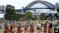 FILE - Traditional Aboriginal dancers perform on Australia Day in Sydney, Australia.