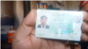 An ethnic Pashtun shows his ID card in Bajaur, Pakistan. Pashtuns say they are being harassed by police and undergoing racial profiling.